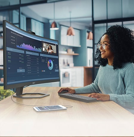 Woman is working with Philips Curved Monitor
