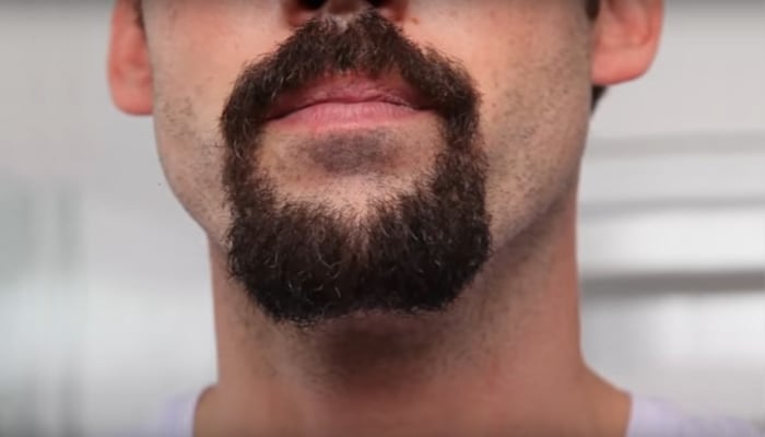 Man’s face with a goatee beard style