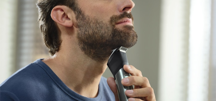 Male using the beard trimmer