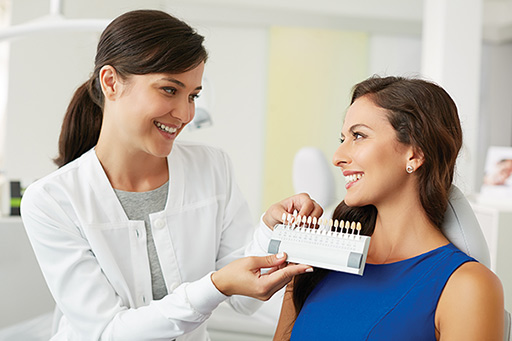 A dental professional with a patient about to undergo teeth whitening