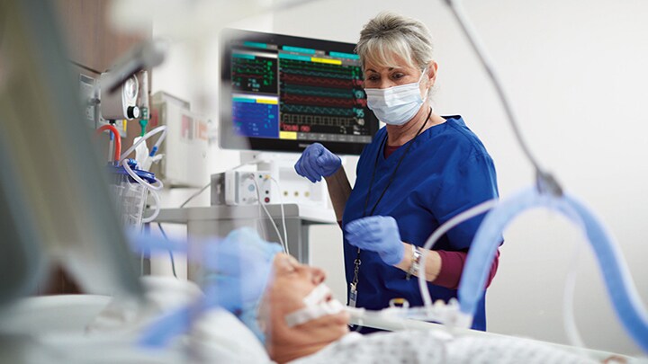 A nurse attending to a patient who is being monitored